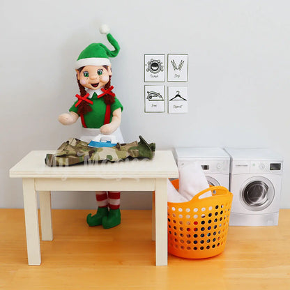 Elf ironing on a wooden mini table and washing basket