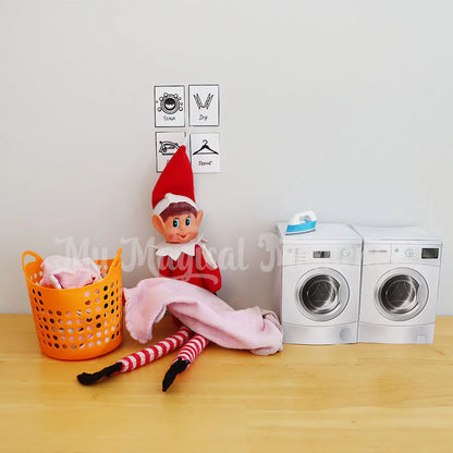 Elf Doing washing with miniature washing machines