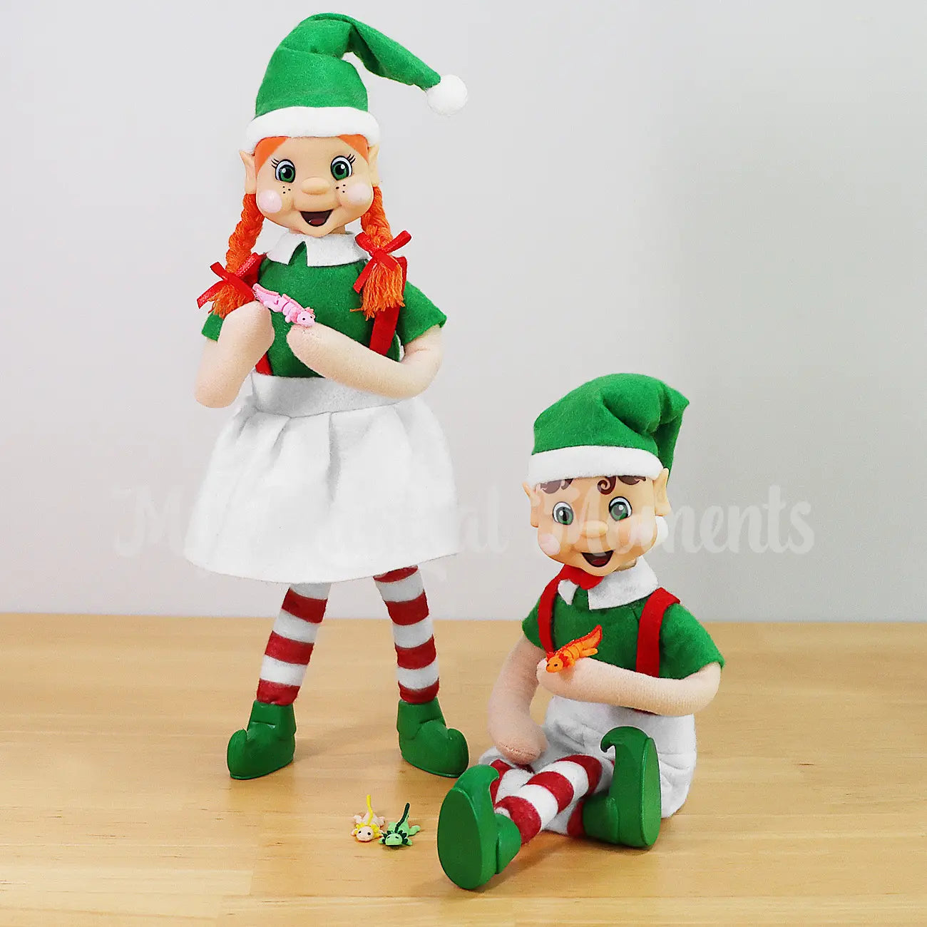 My Elf Friends Elves holding mini axolotl fidgets 