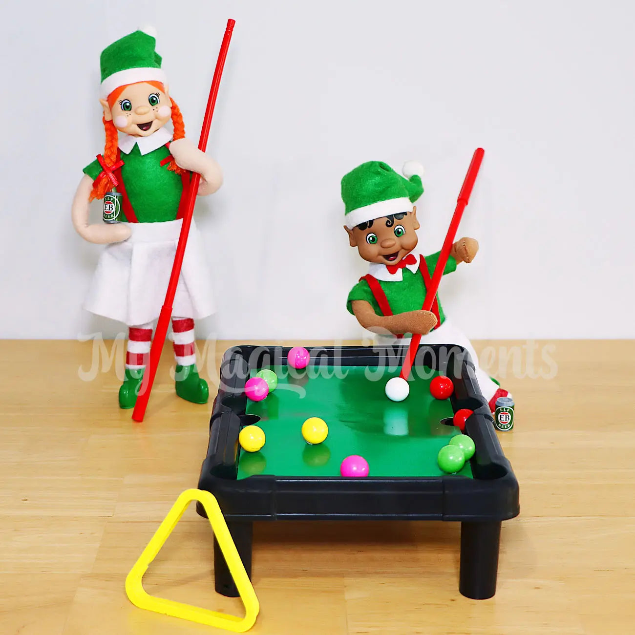 Bendable standing elves playing pool with a mini billiard table drinking beer