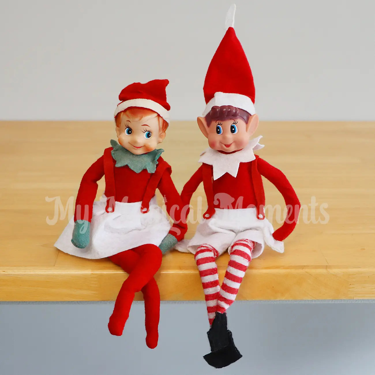 Two elves wearing playsuits