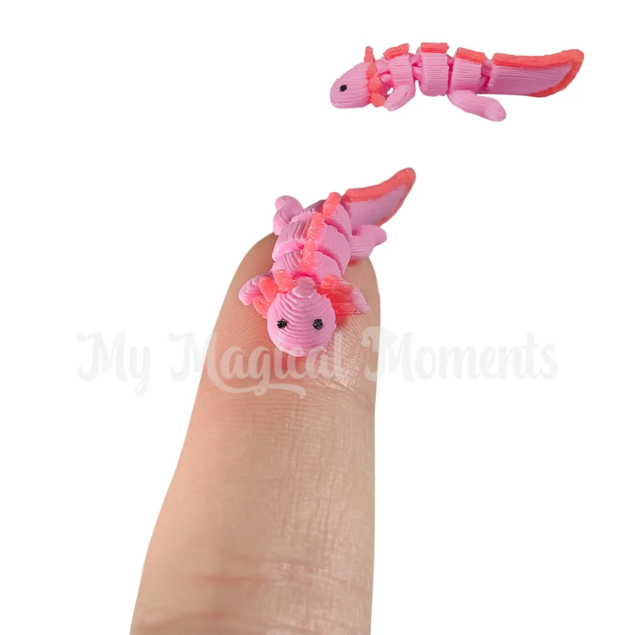 Pink and orange flexible toy on a finger with 'My Magical Moments' branding.