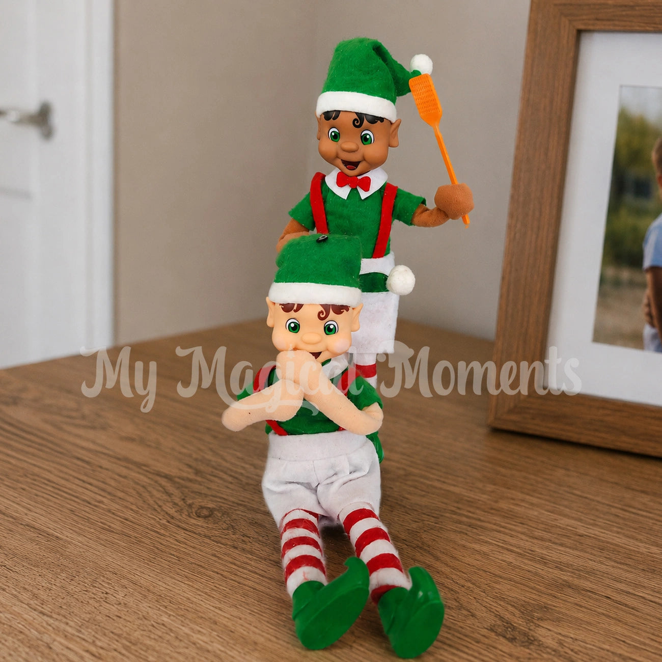 elves hitting one another with a mini fly swatter and a fly