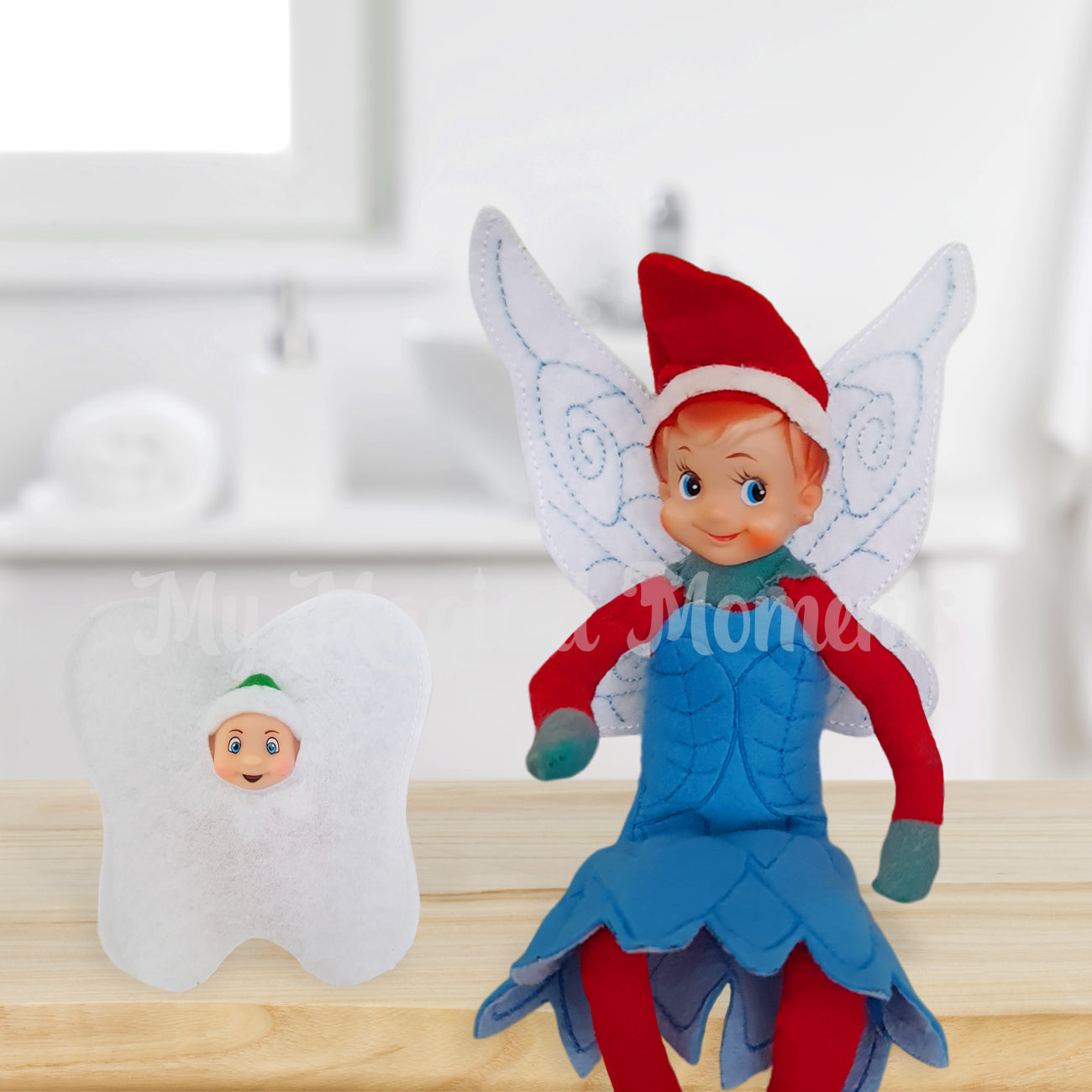 Elf wearing a fairy outfit with a elf baby tooth