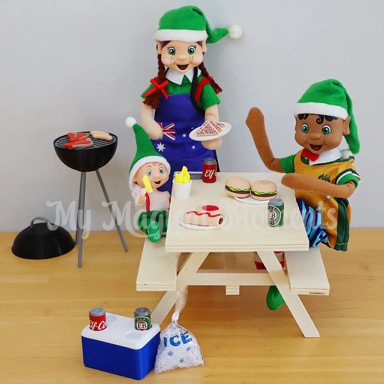 elves having a family picnic with miniature elf food, burger, bbq and esky found