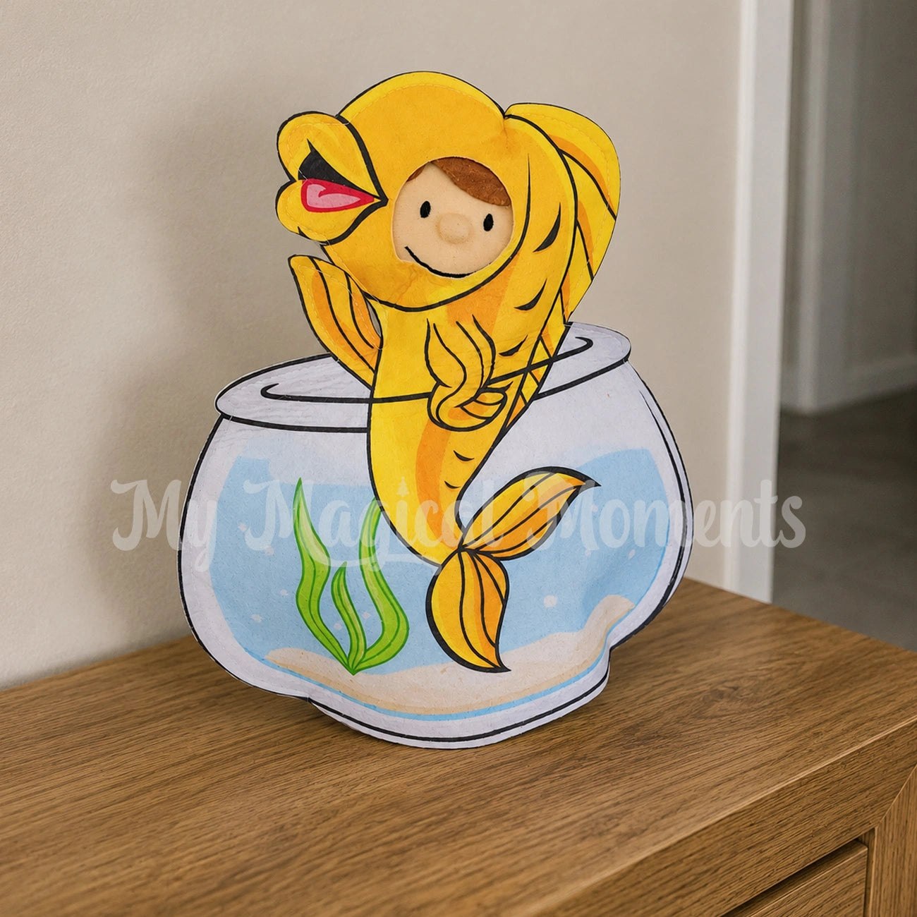 elf wearing a fish bowl costume on a bench