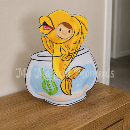elf wearing a fish bowl costume on a bench
