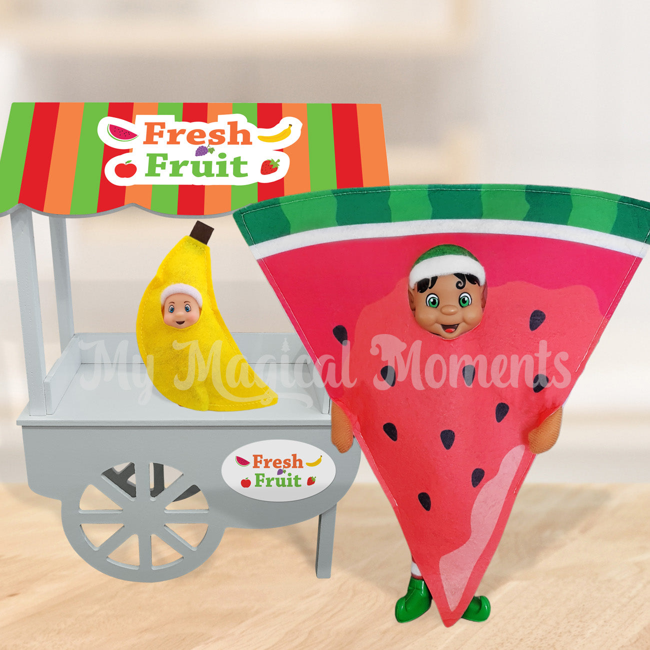 Elf wearing a watermelon costume selling fresh fruit with a elf baby banana
