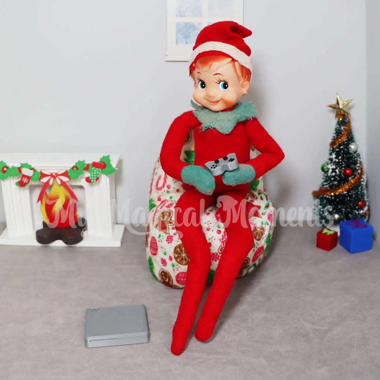 Elf playing a mini console on a bean bag in an elf house