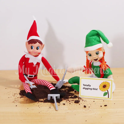 Two Elves digging in grounded up Oreos for dirt with mini gardening elf props