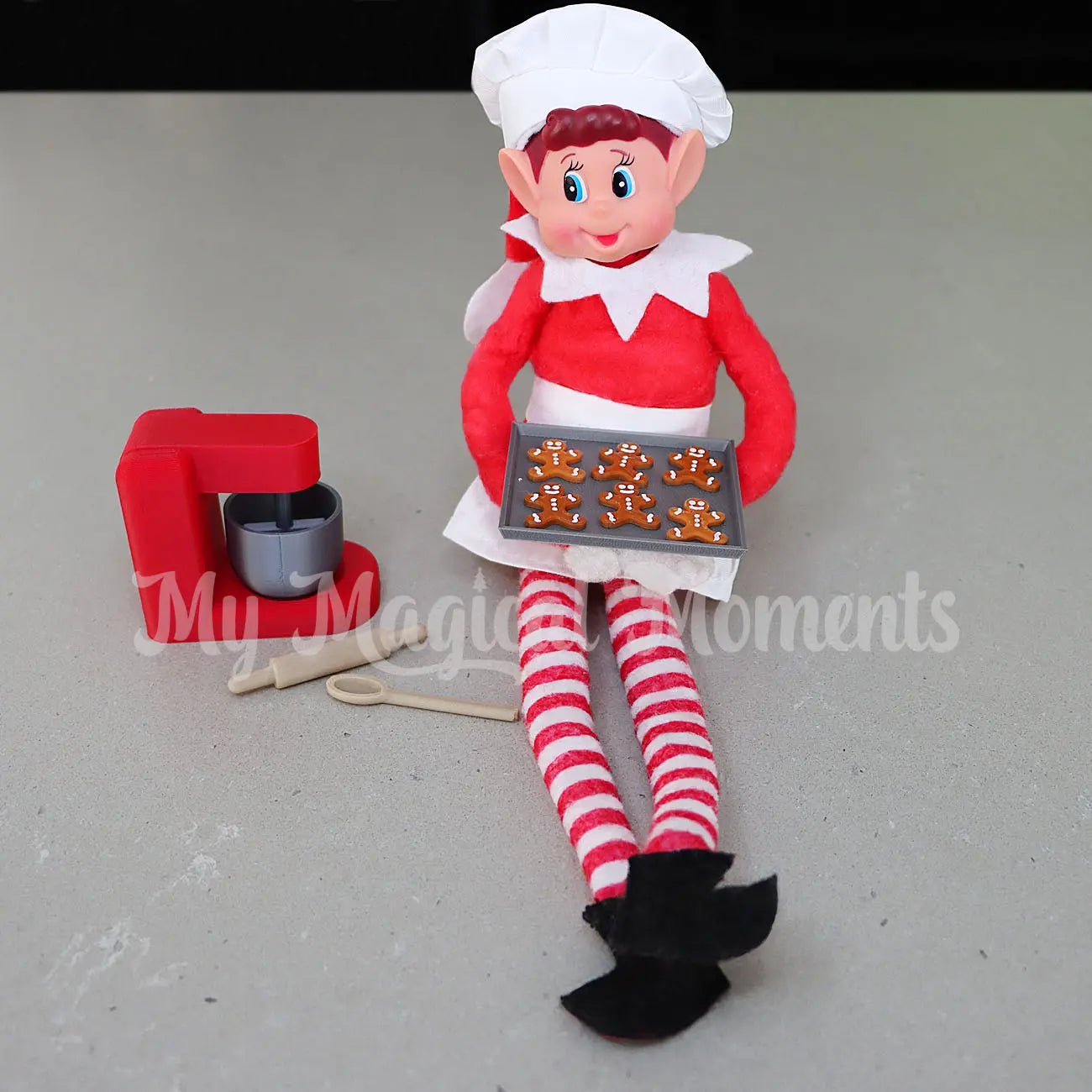 Elf With mini tray of gingerbread cookies and baking set with chef outfit