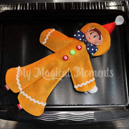 Elf wearing a gingerbread costume in the oven