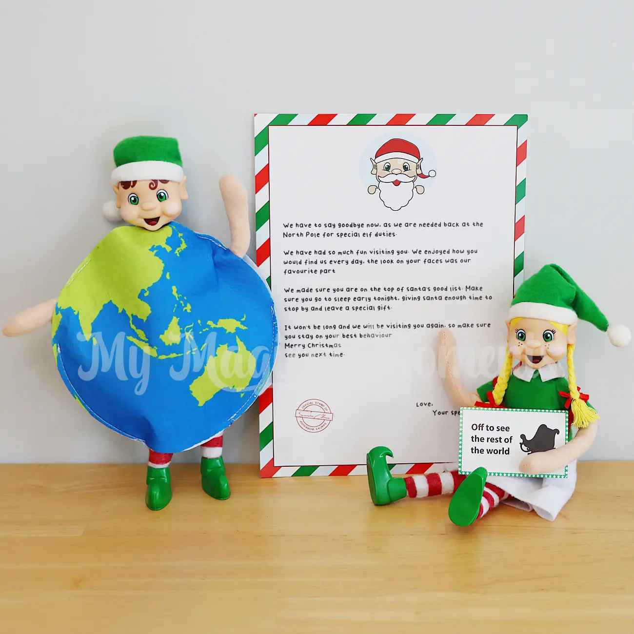 Elf wearing a globe costume with a goodbye letter