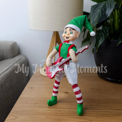 elf playing a mini guitar in the living room