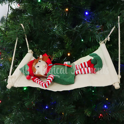 An Elf for Christmas laying on a hammock in the Christmas Tree