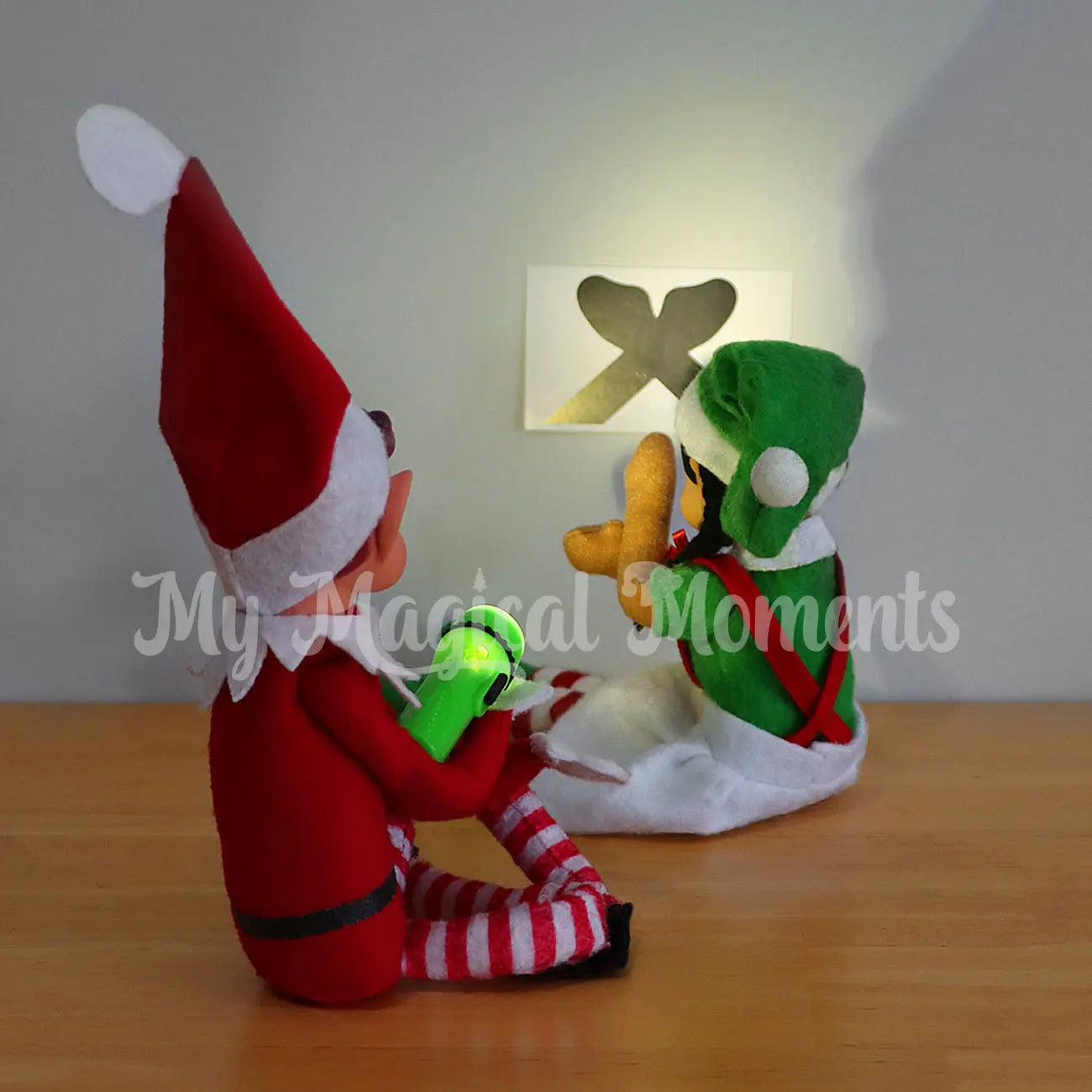 Elves making hand puppets with a torch