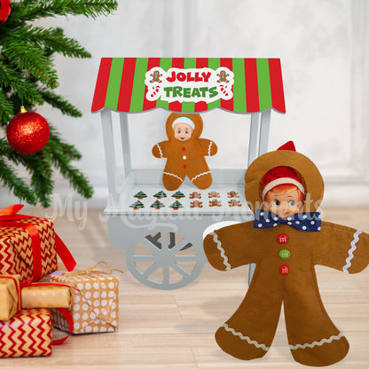 Elf dressed as a gingerbread selling gingerbread cookies