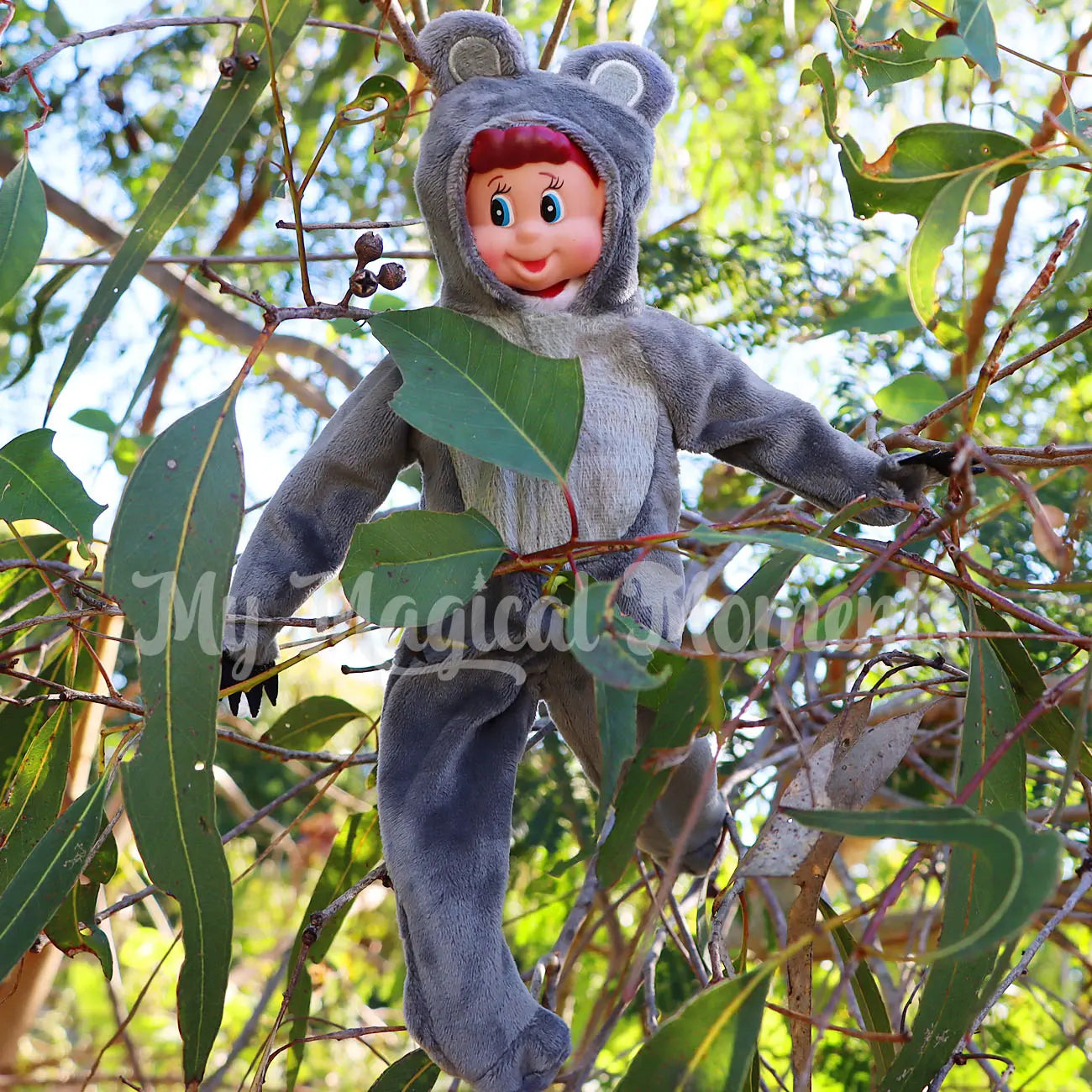 Elves behavin badly wearing a koala costume in a tree