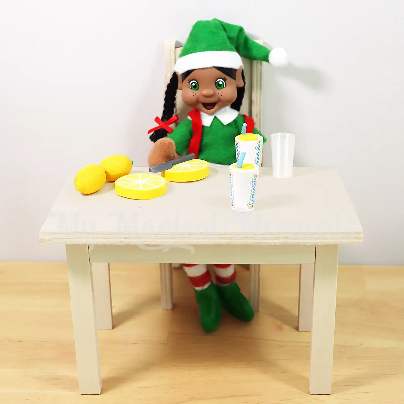 Black hair my elf friends making lemonade on a mini wooden table