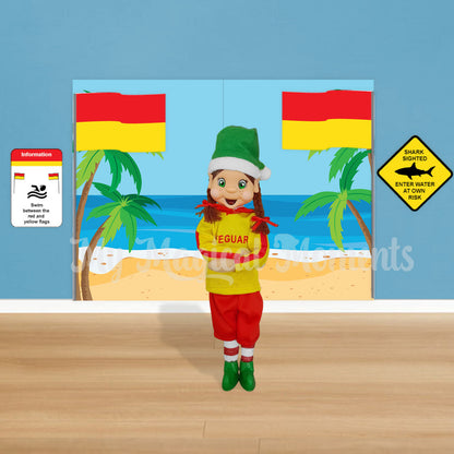 elf dressed as a lifeguard with a beach scene printable and swim between the flags signs.