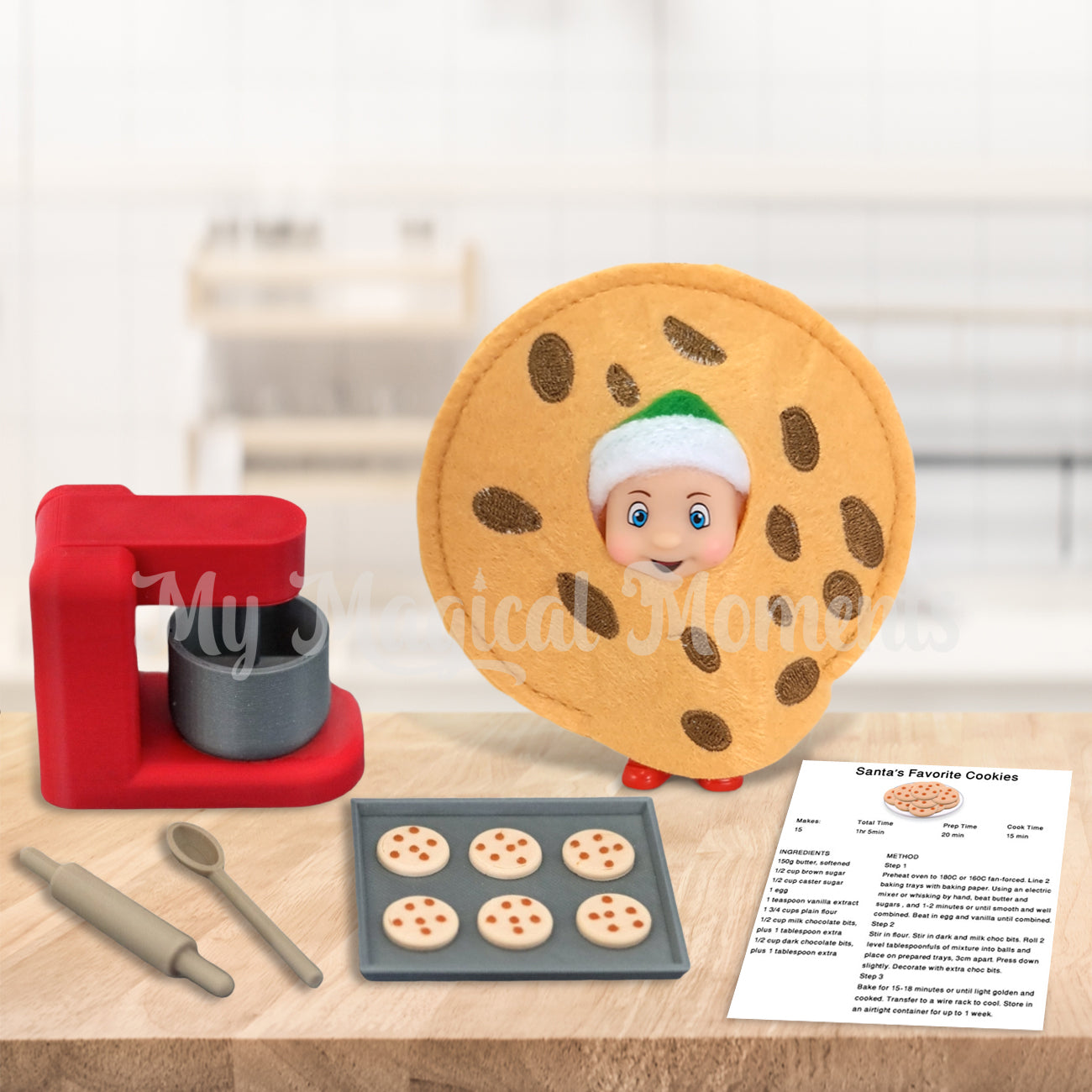 Elf baby dressed as a cookie with a mini recipe and baking set