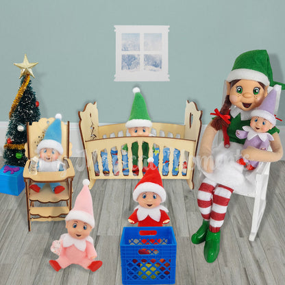 Elf baby daycare, with elf babies wearing different colour onsies. One is in the cot and the other elf baby is in a high chair