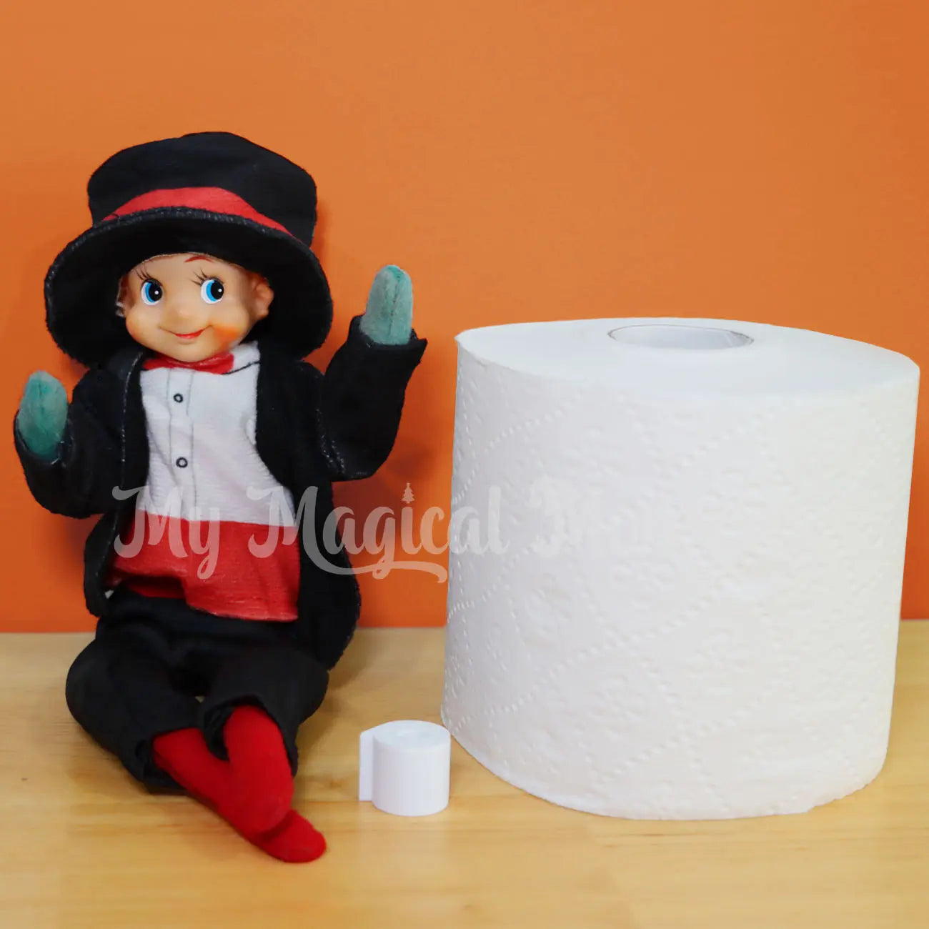 Elf wearing a magician elf turning toilet paper miniature