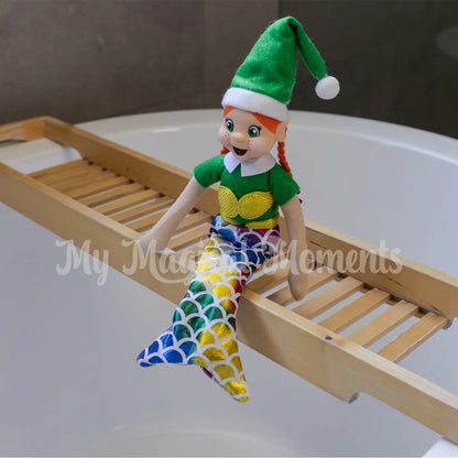 Red headed elf wearing a mermaid costume in bathtub