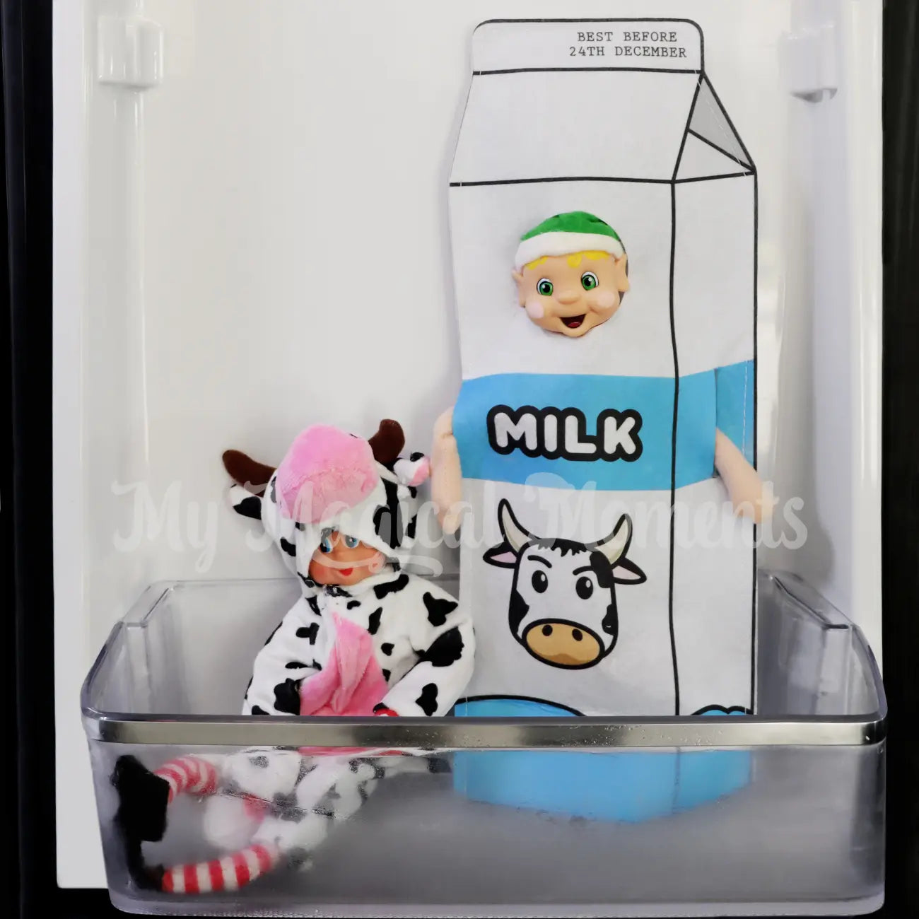 Elf in the fridge with an elf dressed as a cow