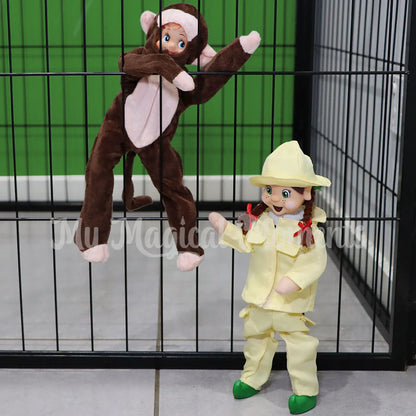 Elf dressed as a monkey in a dog catch with an elf dressed as a zoo keeper