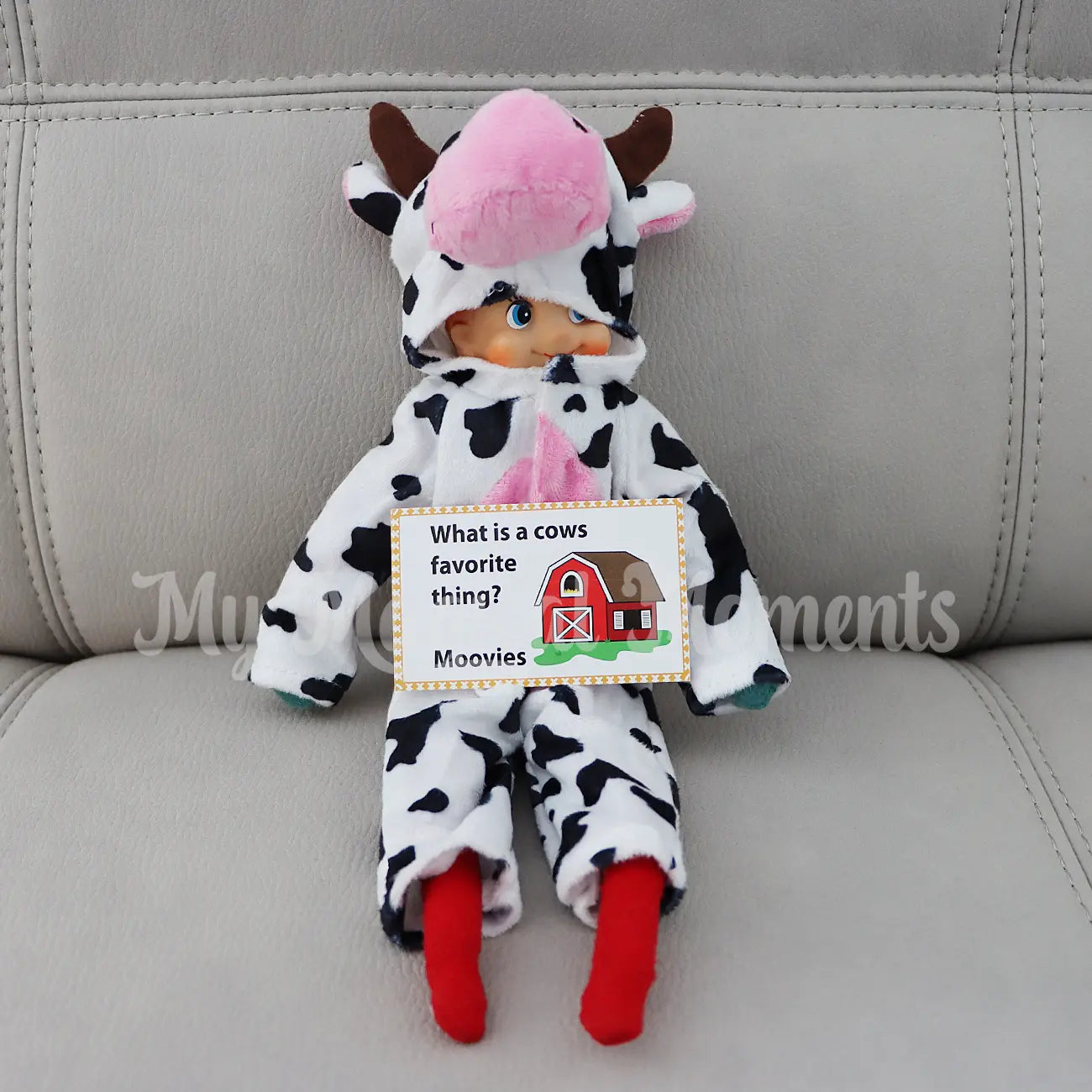 elf wearing a cow costume telling a joke