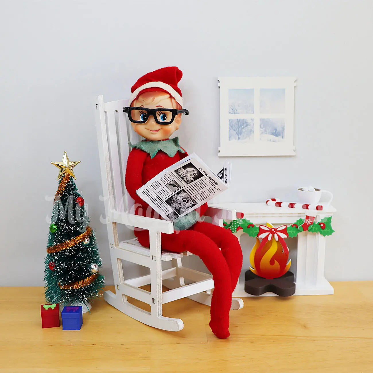 Elf wearing Glasses reading an elf sized newspaper with a mini fireplace, rocking chair presents and window