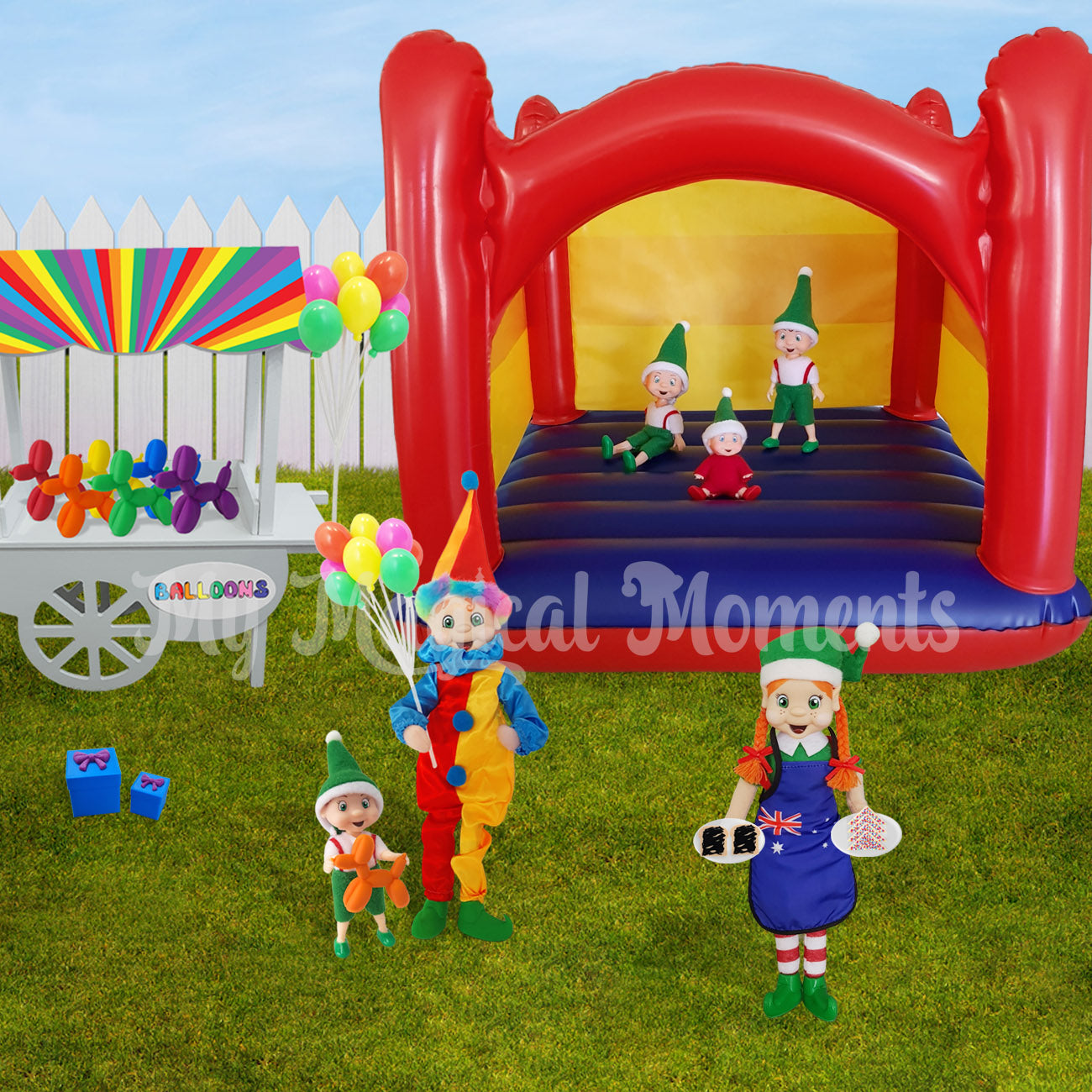 Elves having a birthday party. With a miniature inflatable jumping castle, party food, balloons and an elf wearing a clown costume