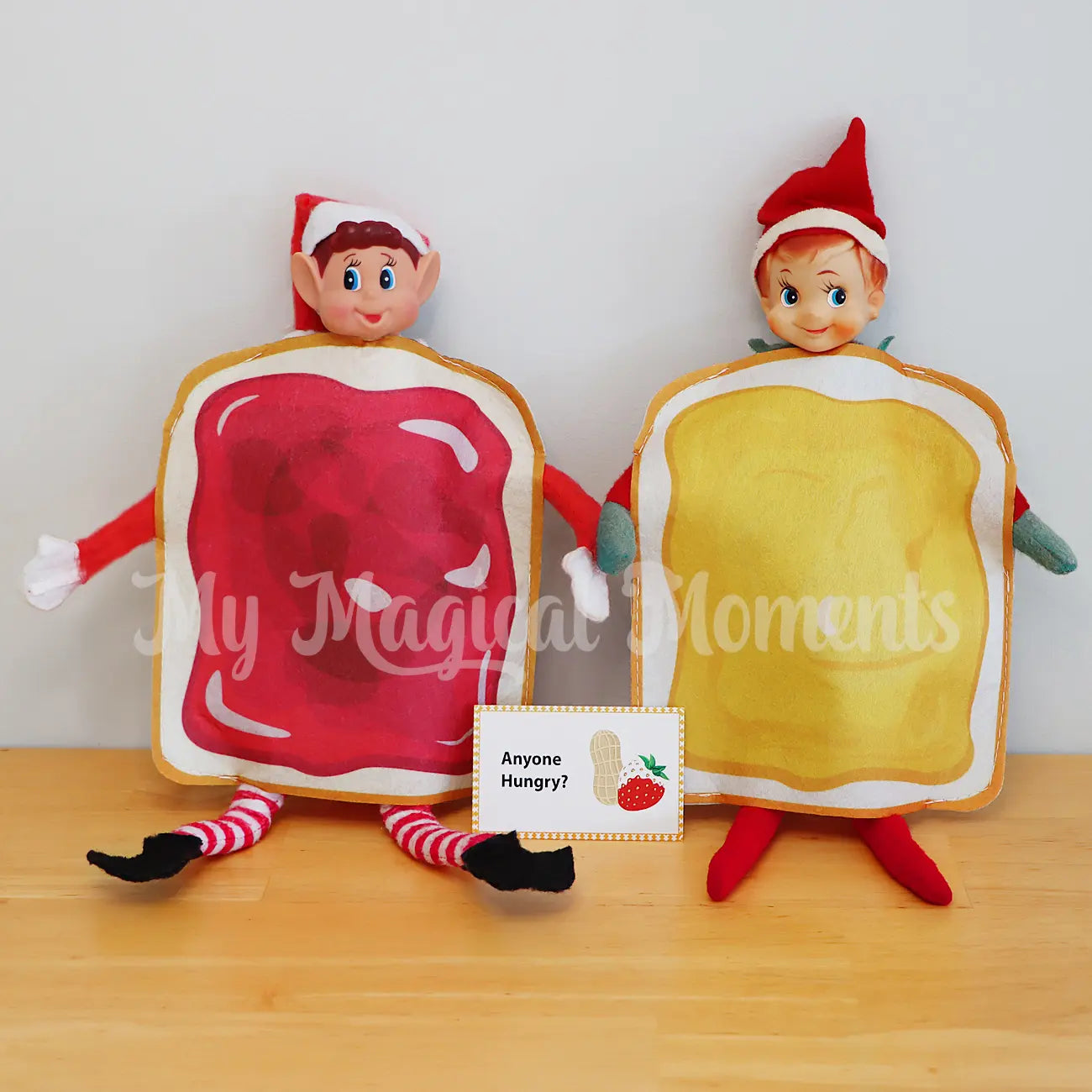 Elves behavin badly wearing a Jam costume, on a kitchen bench