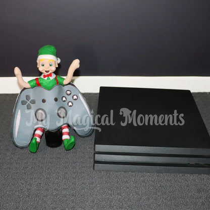 Blonde Hair Elf Wearing a game control costume next to a playstation