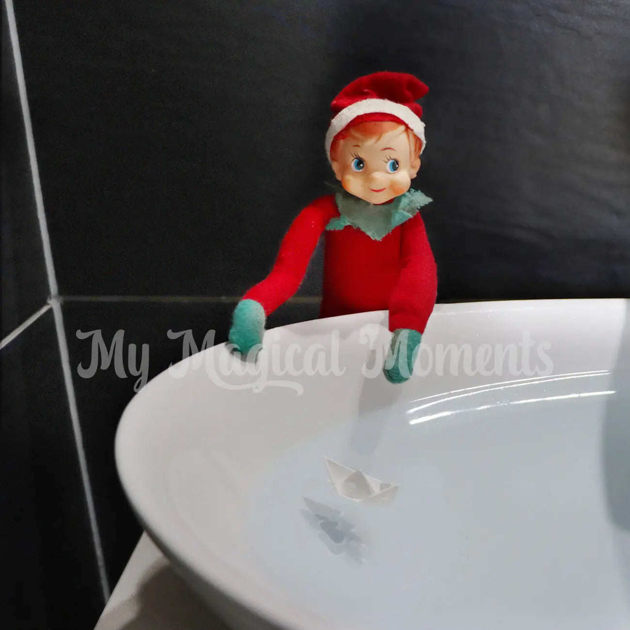 elf having a boat race in the sink