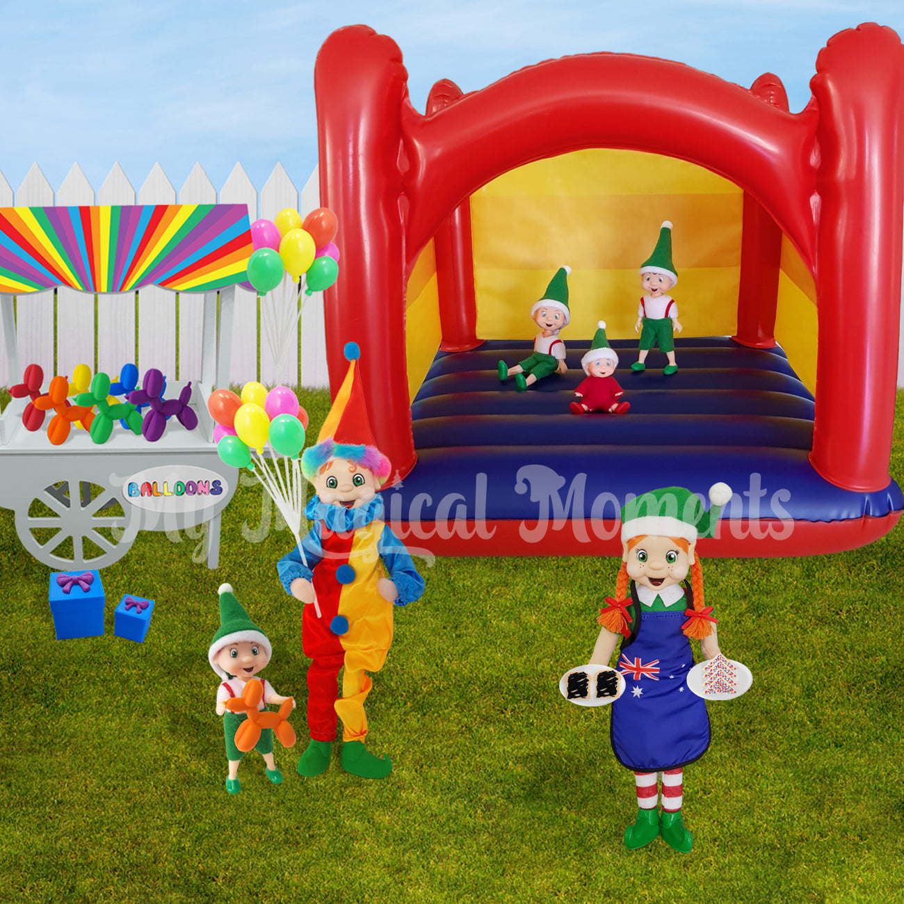 Elves having a birthday party. With a miniature inflatable jumping castle, party food, balloons and an elf wearing a clown costume