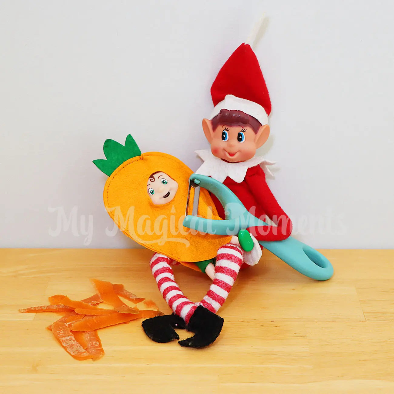 Elf peeling a elf toddler wearing a carrot costume