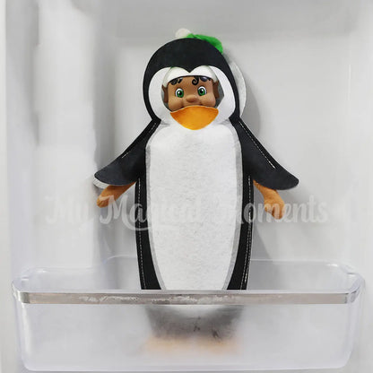 Black hair Elf wearing a penguin costume in the freezer