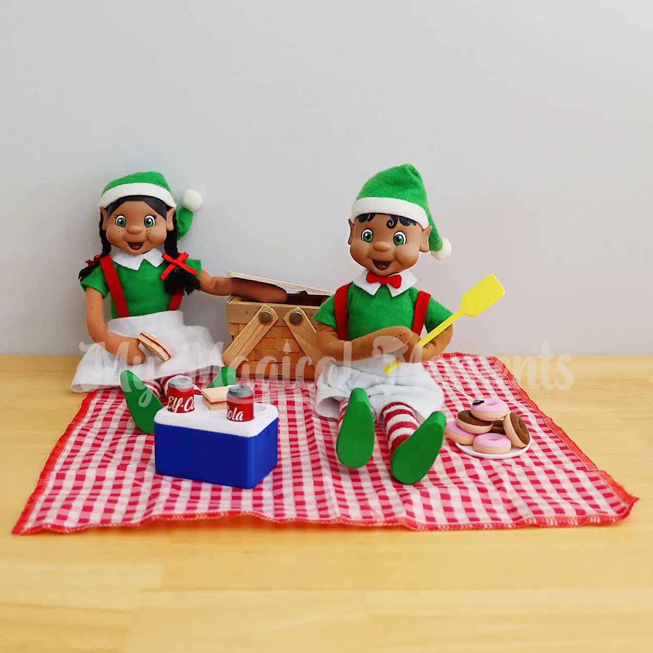 elves having a picnic with a mini esky, fly swatter and donuts