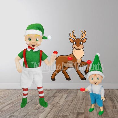 Elf adult and elf toddler playing a game of pin the nose in the house