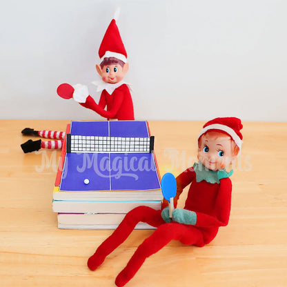 Elves playing ping pong with miniature ping pong accessories