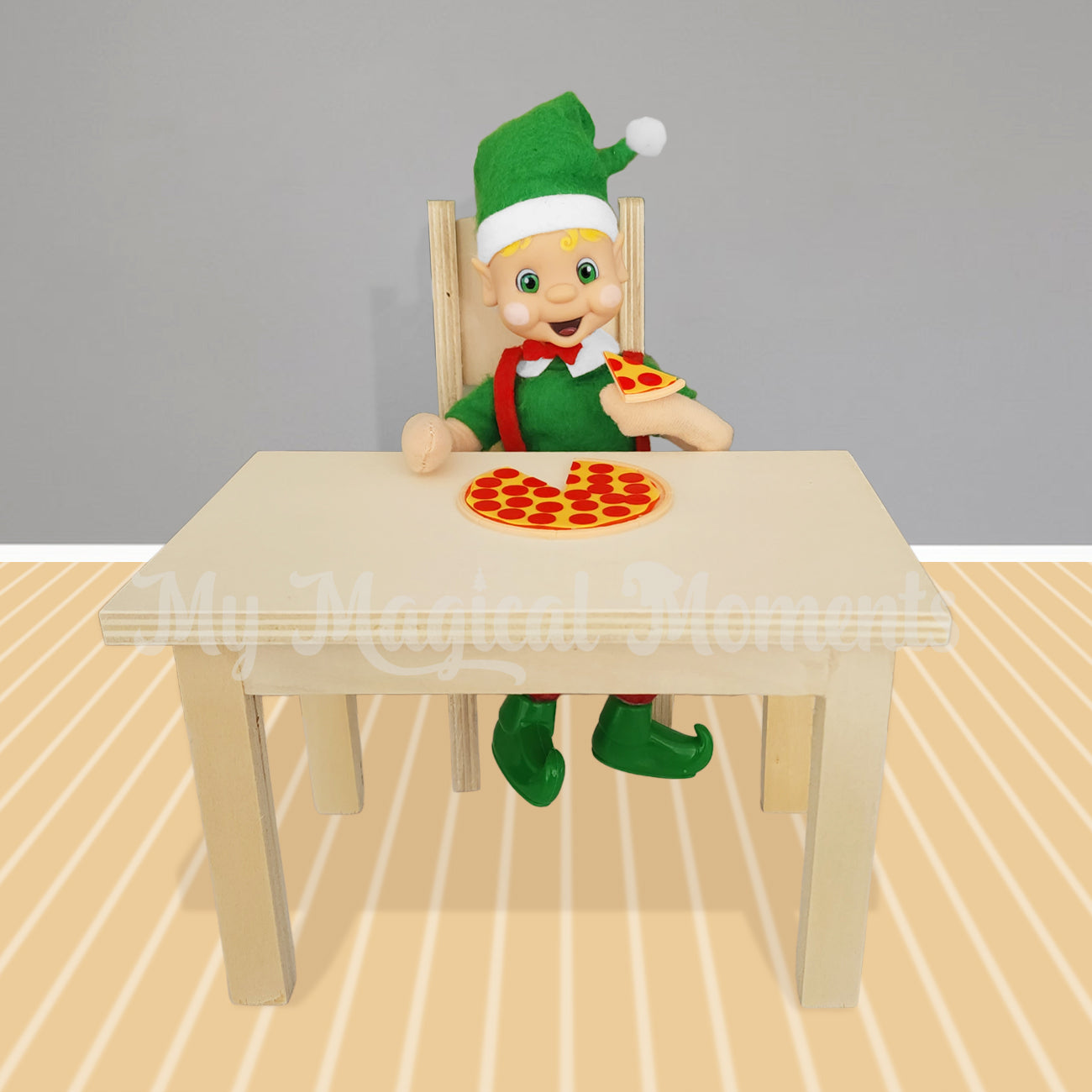 Elf siting at a miniature dining table eating pizza prop