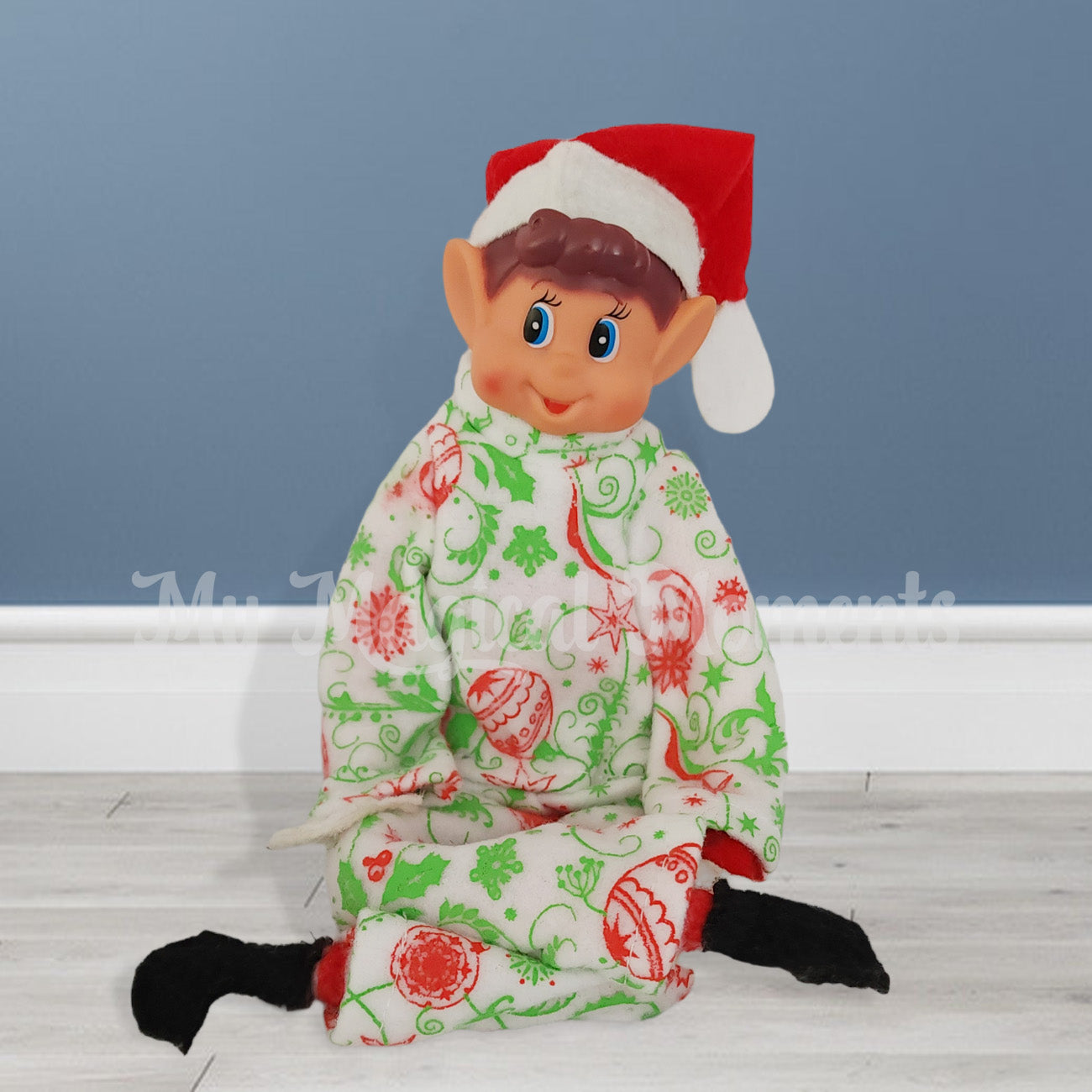 elves behavin badly sitting on the floor wearing pyjamas
