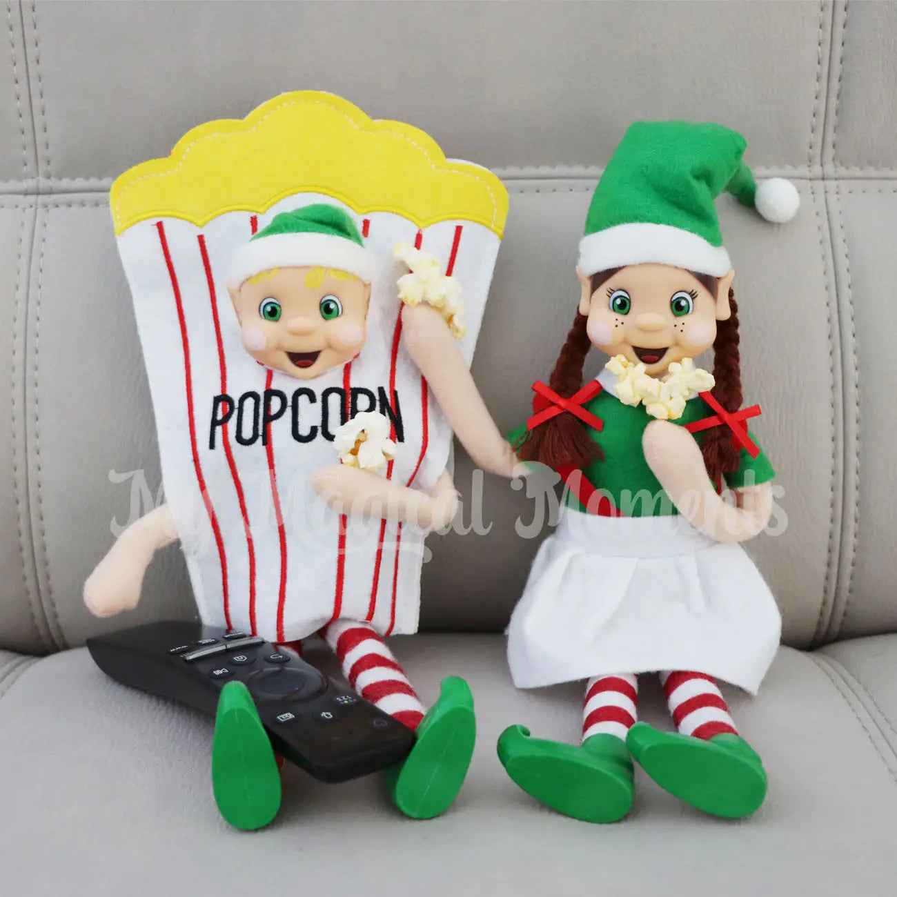 Elves eating popcorn whilst watching a movie wearing a popcorn costume