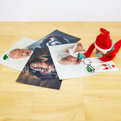 Elf putting elf prank stickers on bay photos