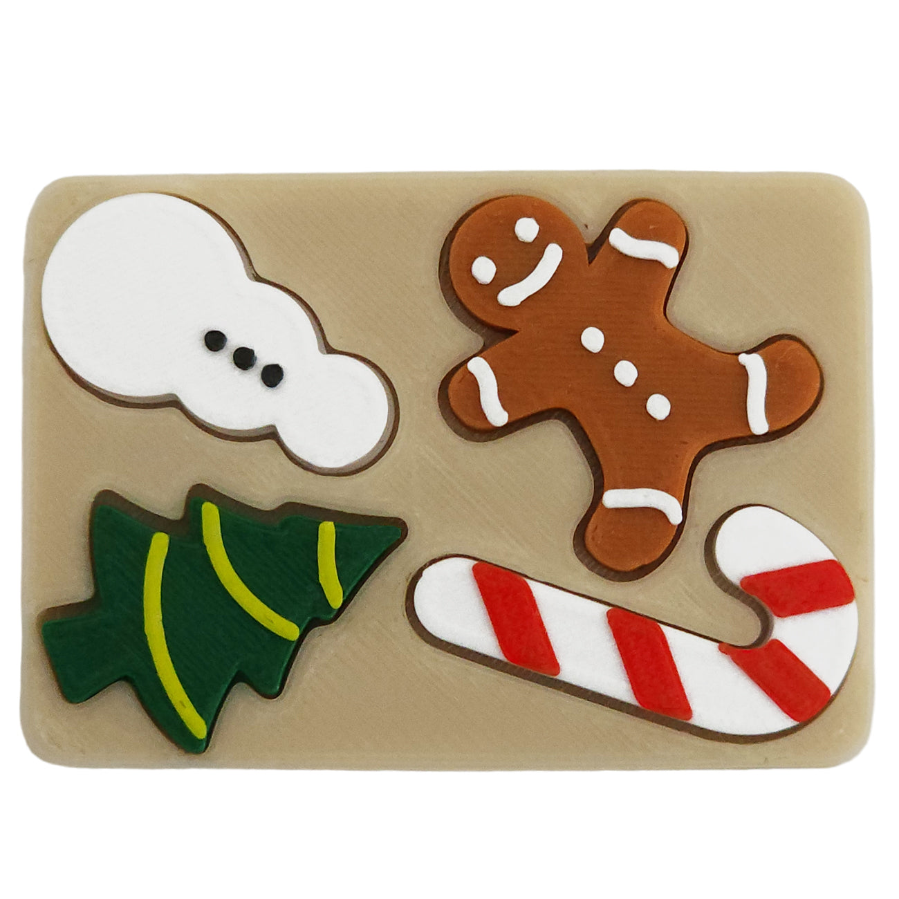 Miniature puzzle elf prop with a snowman piece, gingerbread man piece, candy can piece and Christmas tree piece