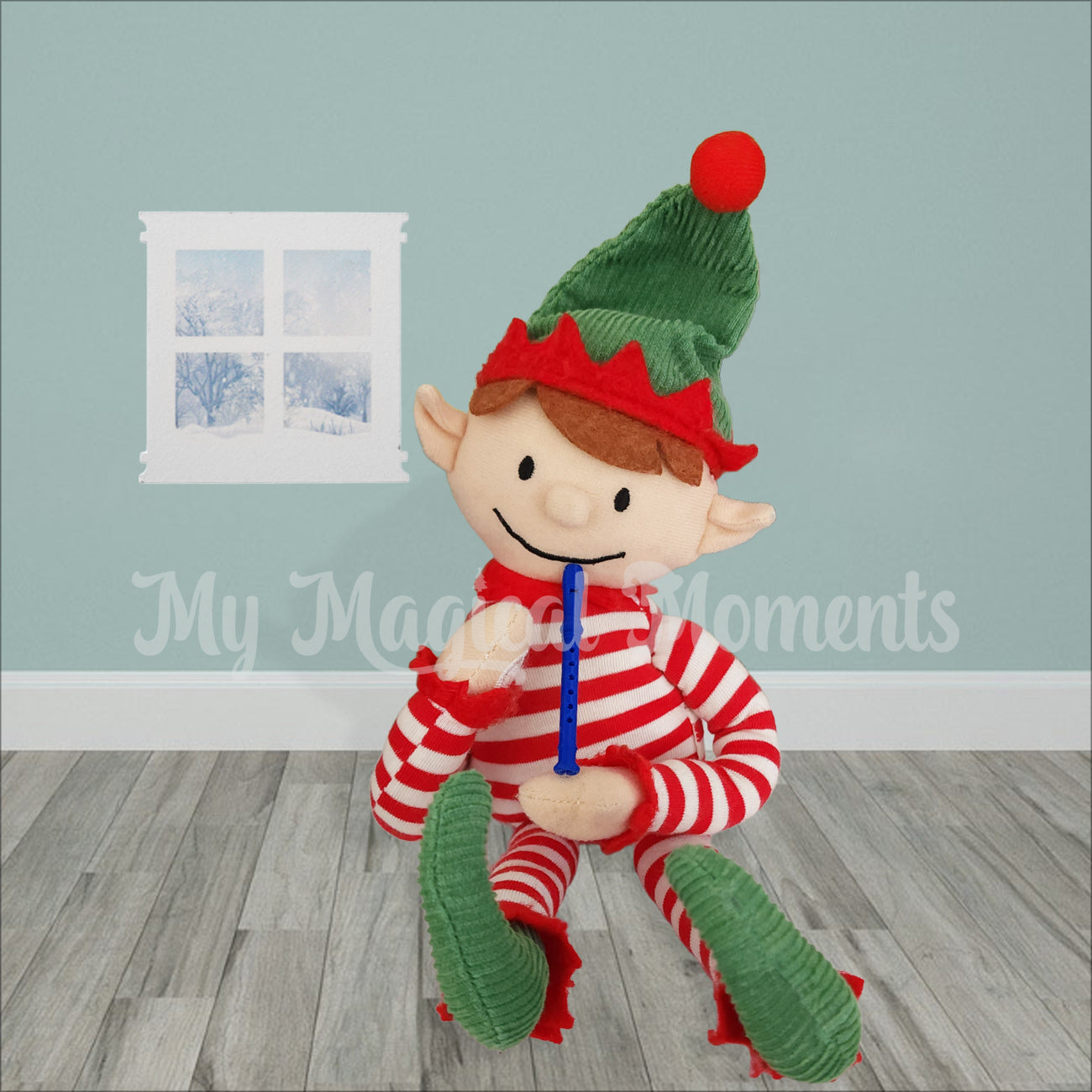 An Elf for Christmas sitting in a room playing a blue recorder elf prop