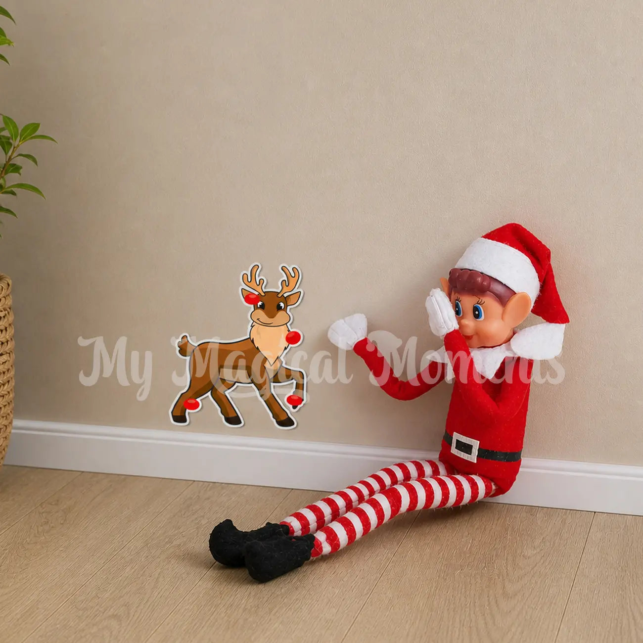 Elves behavin badly playing pin the nose on the reindeer with sticker