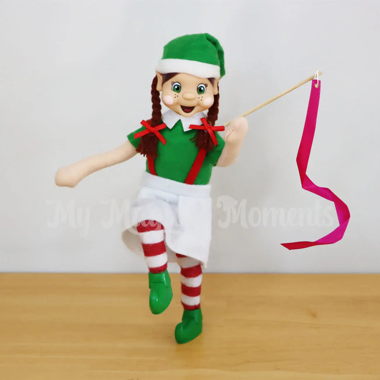 elf holding a ribbon 